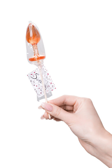 Оранжевый леденец в форме анальной пробки со вкусом амаретто - 29 гр. Оранжевый леденец в форме анальной пробки со вкусом амаретто - 29 гр.