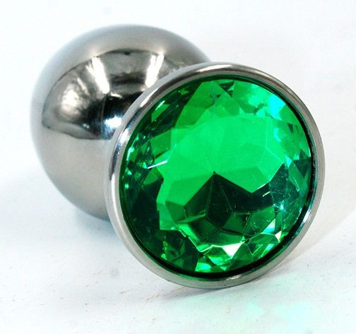 Серебристая средняя анальная пробка с изумрудным кристаллом - 8 см. Серебристая средняя анальная пробка с изумрудным кристаллом - 8 см.