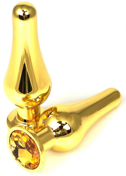 Золотистая удлиненная анальная пробка с оранжевым кристаллом - 10 см. Золотистая удлиненная анальная пробка с оранжевым кристаллом - 10 см.